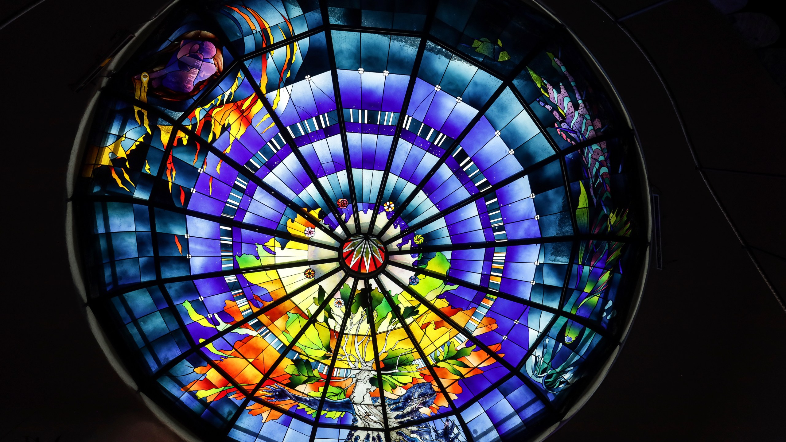 A stained-glass dome titled The Second Innocence, the Dream of Dionisyos, by Italian artist Narcissus Quagliata decorates the El Santuario Resort hotel in Valle de Bravo, Mexico, Wednesday, Oct. 25, 2023. Over the last five decades, Quagliata has created these stained-glass artworks for sacred spaces, private homes and public exhibitions, using a fusible glass technique. (AP Photo/Ginnette Riquelme)