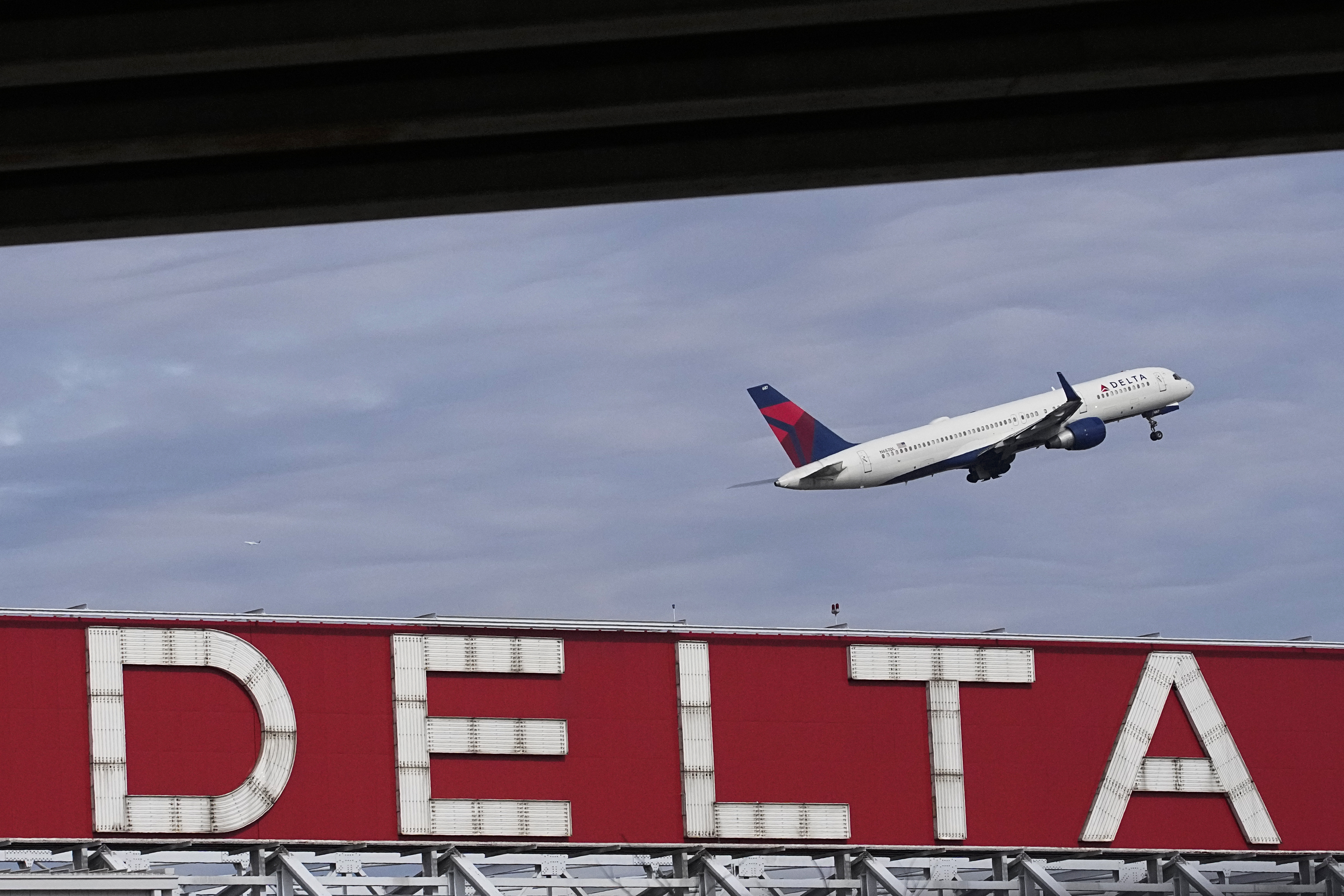 FILE - A Delta Air Lines plane takes off from Hartsfield-Jackson Atlanta International Airport, Nov. 22, 2022, in Atlanta. In a statement released Wednesday, Nov. 1, 2023, Delta Air Lines said the pilot accused of threatening to shoot the plane's captain during a flight no longer works for the airline, and federal officials say his authority to carry a gun on board was revoked. (AP Photo/Brynn Anderson, File)