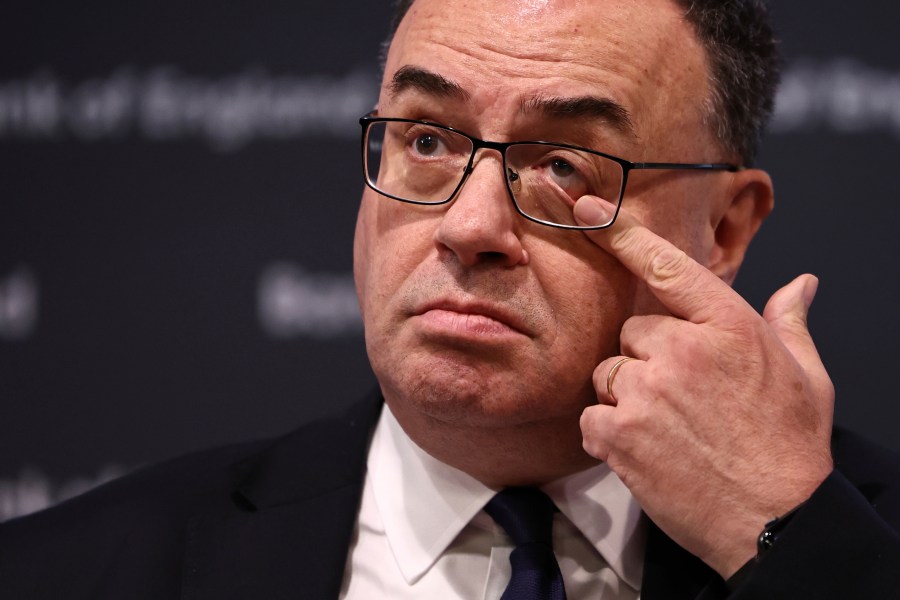 Governor of the Bank of England Andrew Bailey touches his eye as he arrives to address the media during a press conference concerning interest rates, at the Bank of England, in London, Thursday, Nov. 2, 2023. The Bank of England kept its main interest rate unchanged on Thursday at the 15-year high of 5.25% and indicated that borrowing costs will likely remain at these sort of elevated levels for a while, especially if oil and gas prices increase sharply in light of the conflict between Israel and Hamas. (Henry Nicholls/Pool Photo via AP)