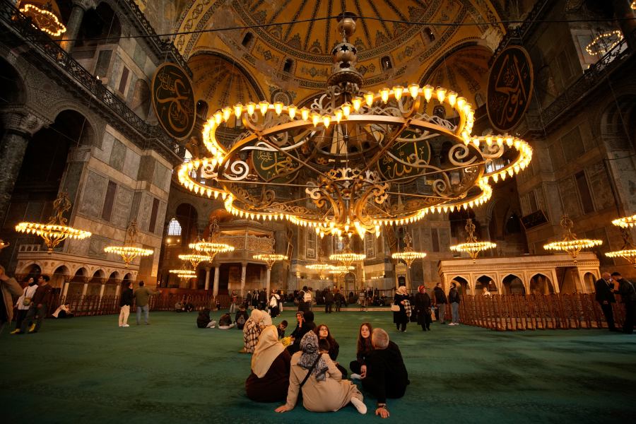 People visit Byzantine-era Hagia Sophia mosque in Istanbul, Turkey, Sunday, April 13, 2025. (AP Photo/Emrah Gurel)