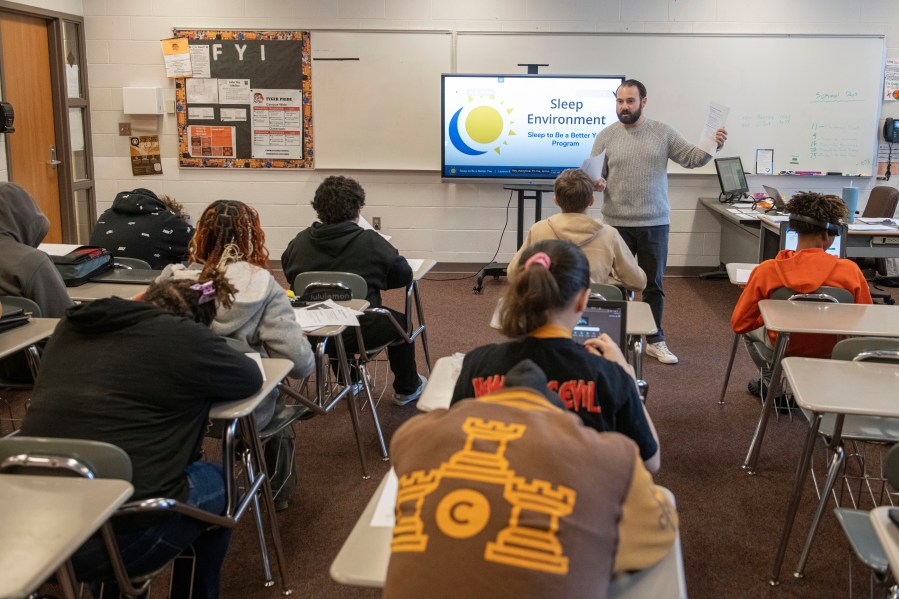 Mansfield Senior High School teacher Tony Davis talks to his health class about the topic of sleep Friday, Dec. 6, 2024, in Mansfield, Ohio. (AP Photo/Phil Long)