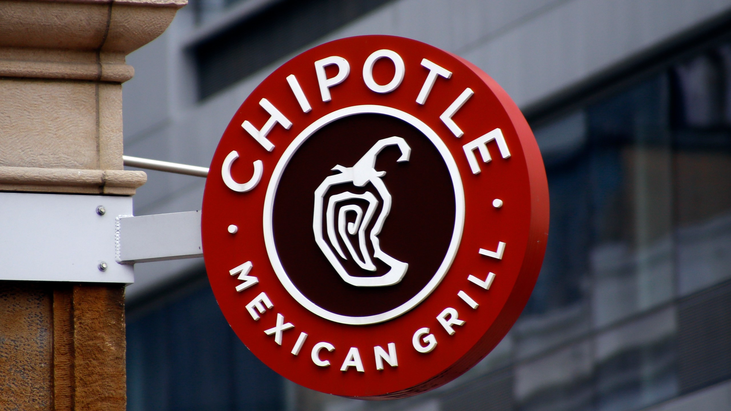 FILE - A sign for the Chipotle restaurant in Pittsburgh's Market Square is seen on Feb. 8, 2016. (AP Photo/Keith Srakocic, File)