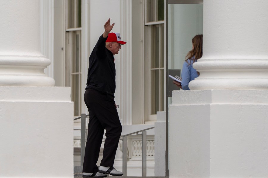 President Donald Trump waves as he returns to the White House, Sunday, April 20, 2025, in Washington. (AP Photo/Alex Brandon)