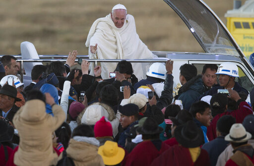 FILE - Pope Francis waves from the popemobile after arriving to El Alto International airport in El Alto, Bolivia, Wednesday, July 8, 2015. (AP Photo/Eduardo Verdugo, file)