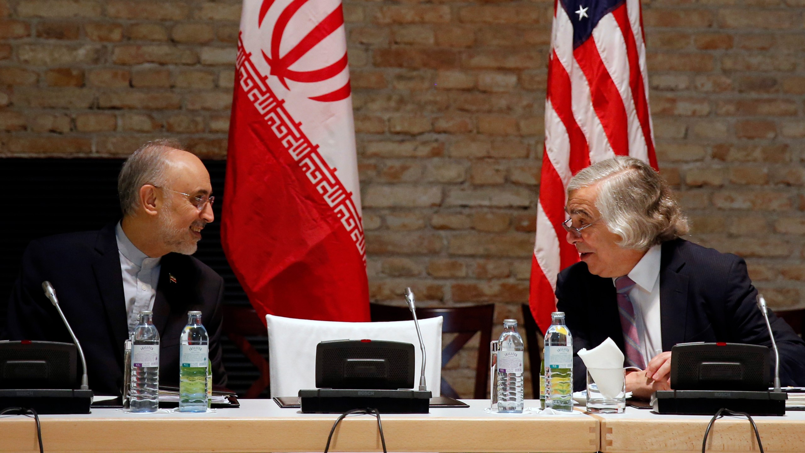 FILE - U.S. Secretary of Energy Ernest Moniz and Head of the Iranian Atomic Energy Organization Ali Akbar Salehi, left, meet at an hotel in Vienna, July 9, 2015. (Carlos Barria/Pool Photo via AP, File)