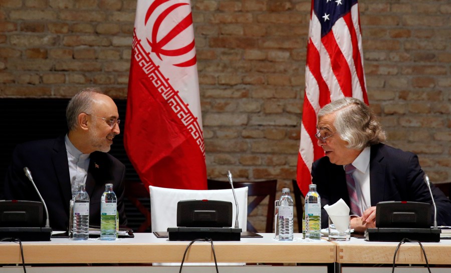 FILE - U.S. Secretary of Energy Ernest Moniz and Head of the Iranian Atomic Energy Organization Ali Akbar Salehi, left, meet at an hotel in Vienna, July 9, 2015. (Carlos Barria/Pool Photo via AP, File)